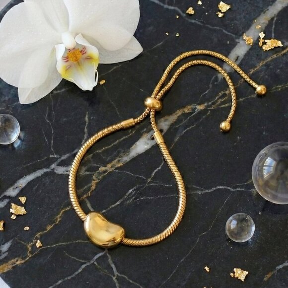 18K Gold Plated Stainless Steel Adjustable Bracelet With Smooth Bean Charm - Picture 6 of 9